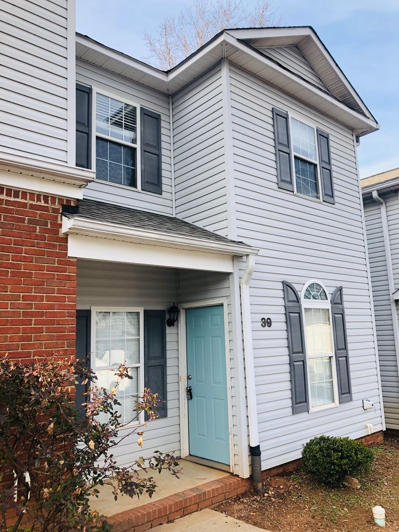 Close to Downtown Greer - this is a Fantastic 2 Bedroom, 2.5 Bathroom end unit condo that offers tons of storage and open space.