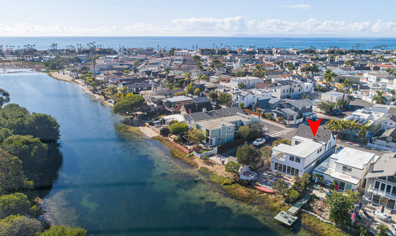 NEWLY REMODELED SINGLE-FAMILY HOME ON THE CANAL FRONT IN NEWPORT SHORES