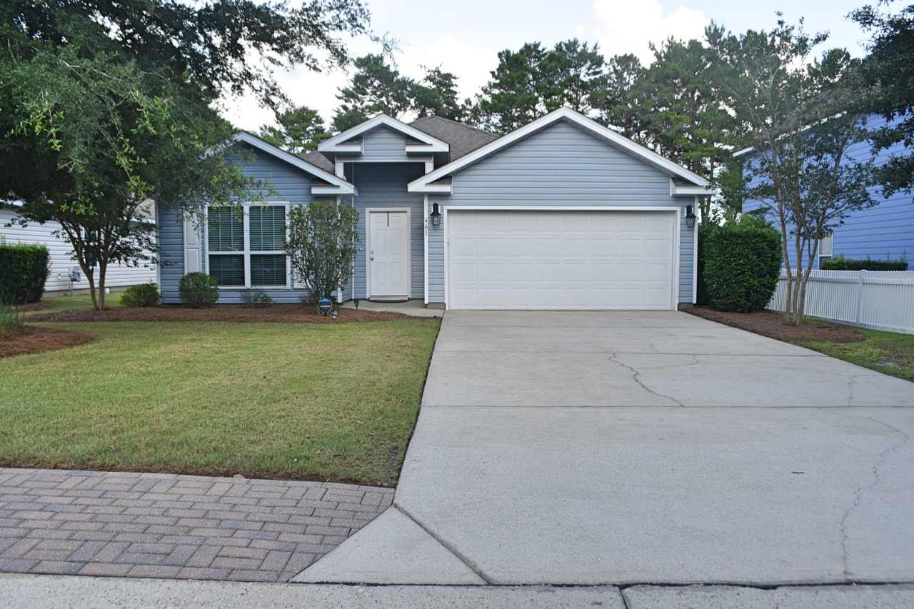 Roomy 4 bedroom 2 bath home in Schooner Landing backs up to the playground/pool area.