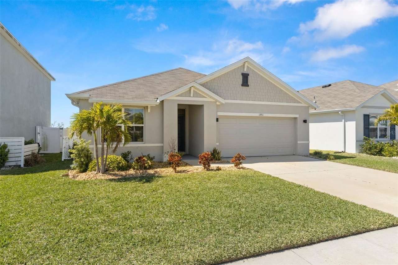 13911 SMILING DAISY PLACE