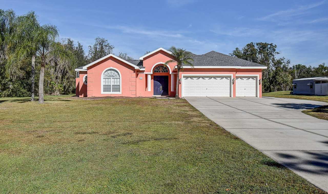 Beautiful 4/3/3 on a private 1 acre lot.