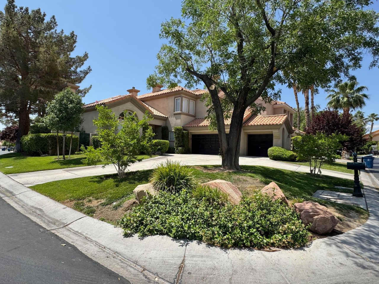 BEAUTIFUL TWO-STORY 4 BEDROOM 3 BATH HOME ON A CORNER LOT IN THE GUARD-GATED CANYON GATE COMMUNITY.