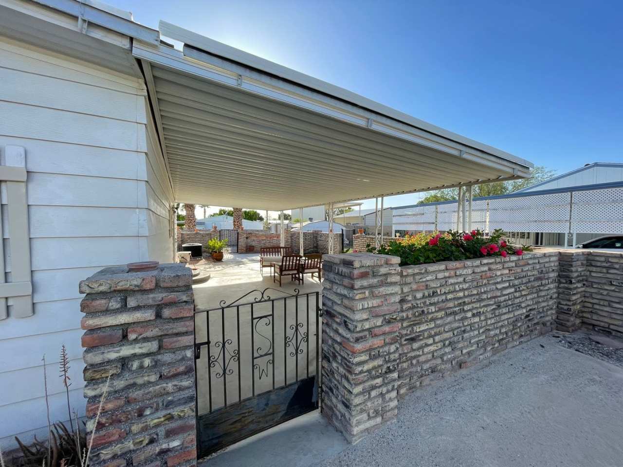 Partially Furnished Manufactured Home on its own Large Corner Lot! *No HOA*