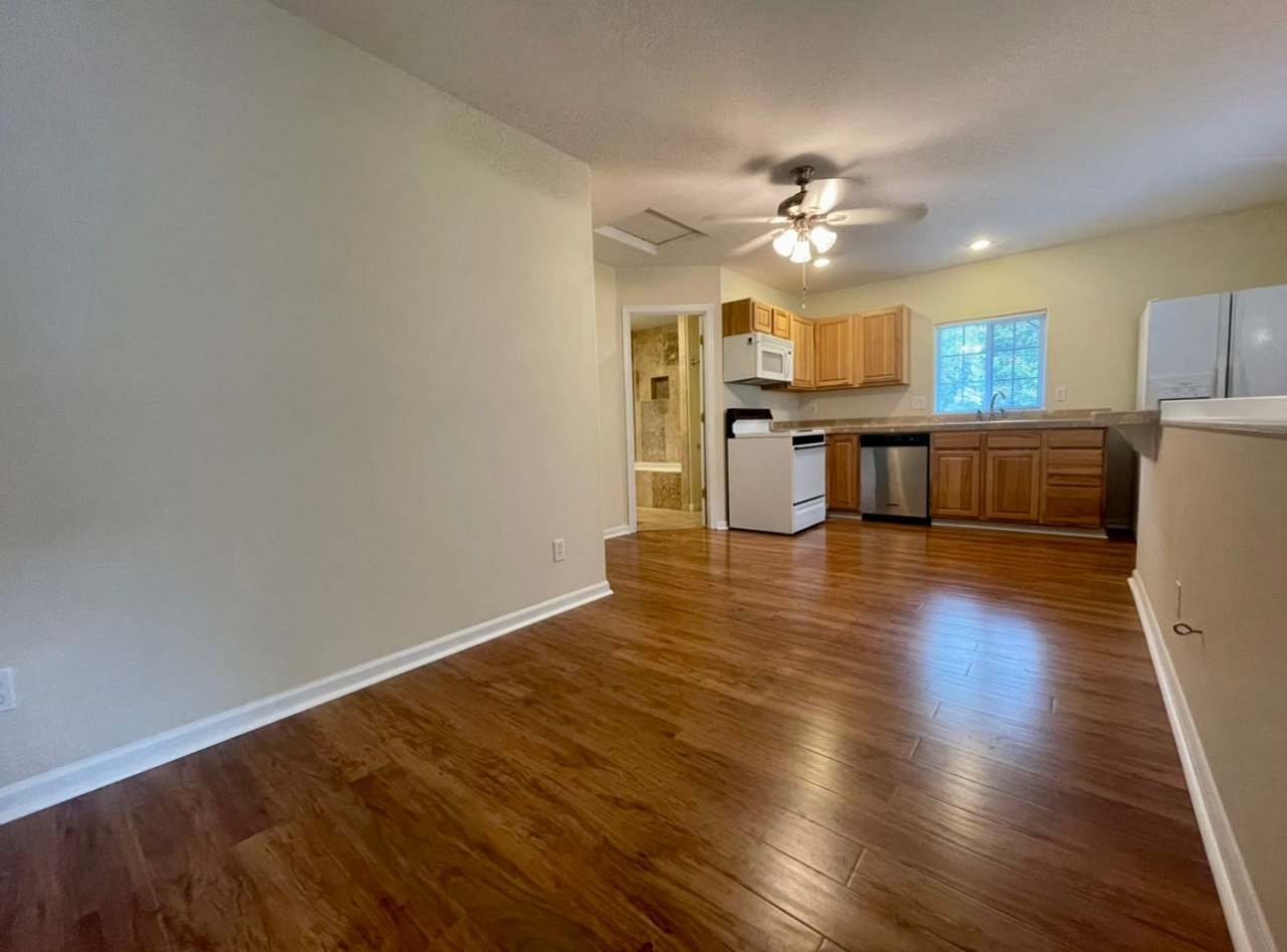 Spacious One Bedroom in Quiet 5 Plex with Courtyard Setting~ Open Floor Plan~ Great Shared Outdoor Space~ Off Street Parking!