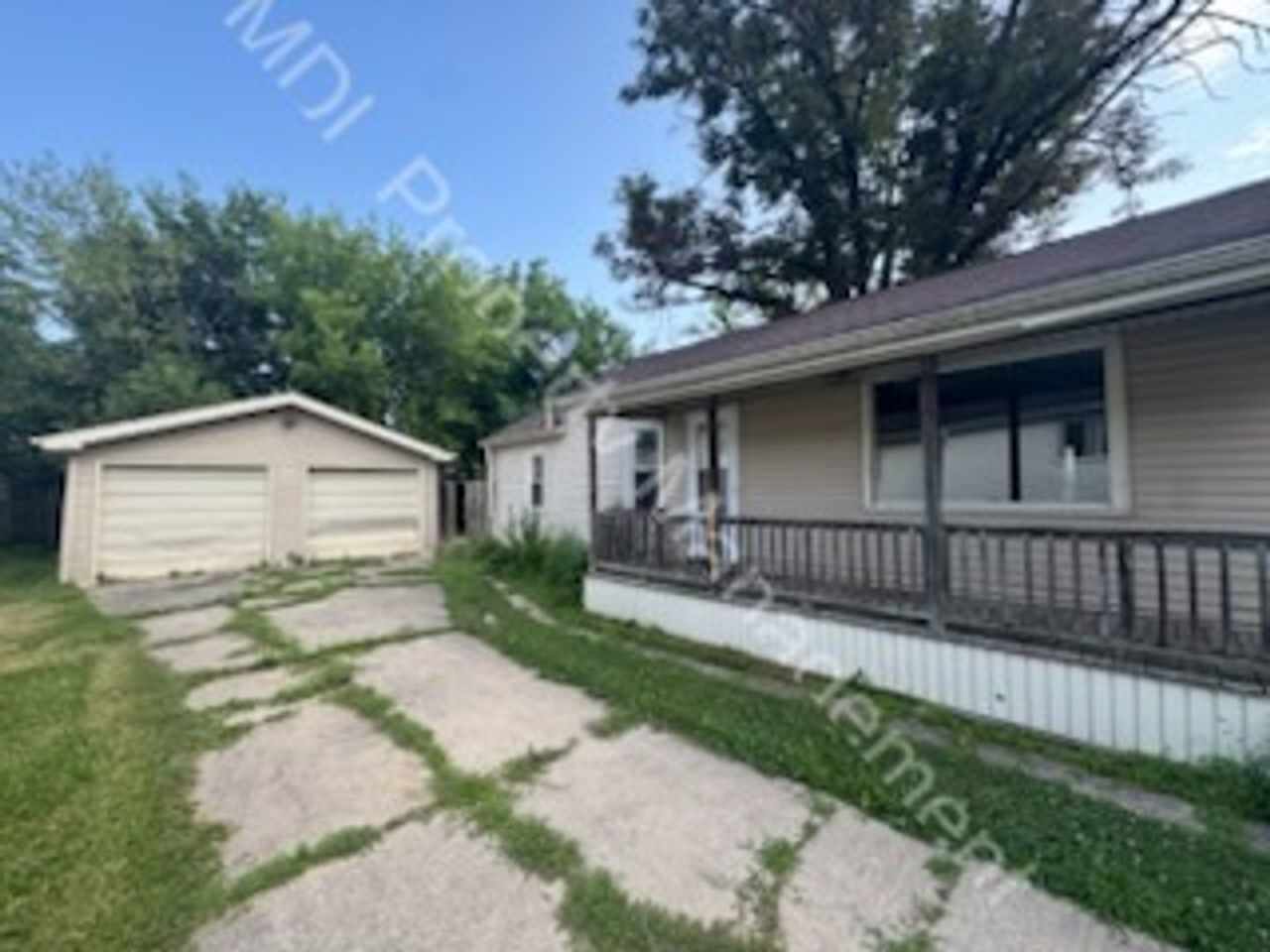 Spacious 3 bed 1 bath with 2 car garage and fenced in backyard