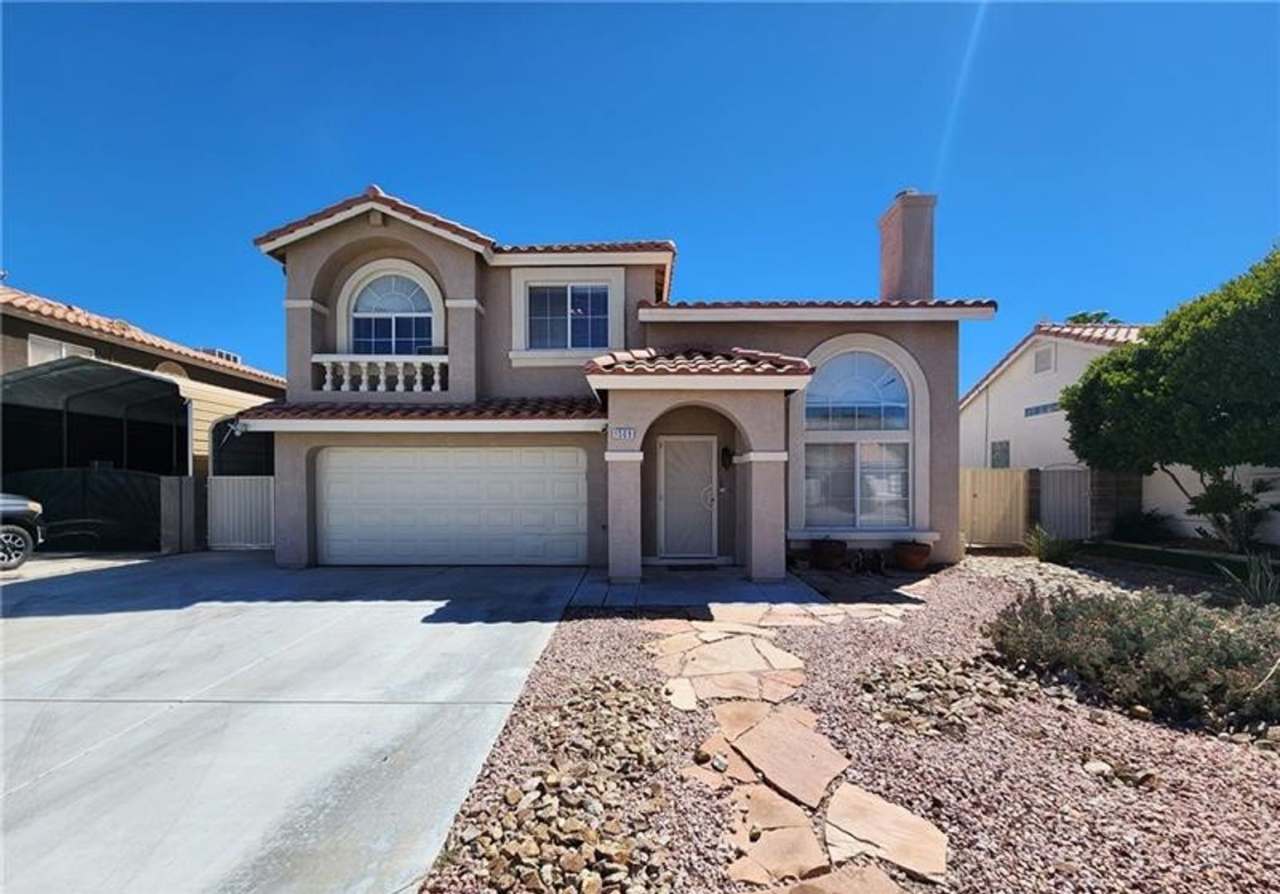 Beautiful two story home with a two car garage, covered RV gate, and dedicated RV parking.