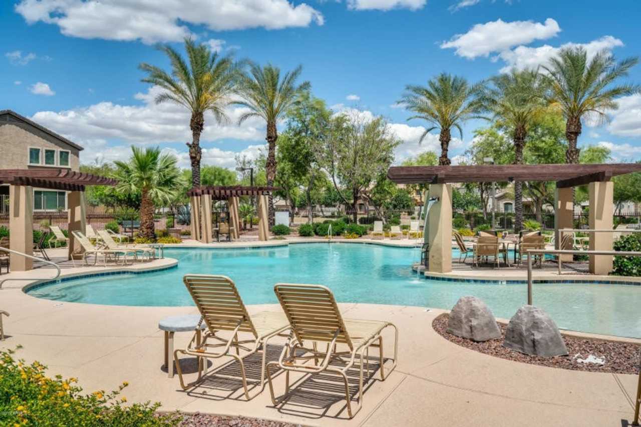 Charming 3 Bed + Den 2.5 Bath Home with 2 car attached EV garage with community pool !!