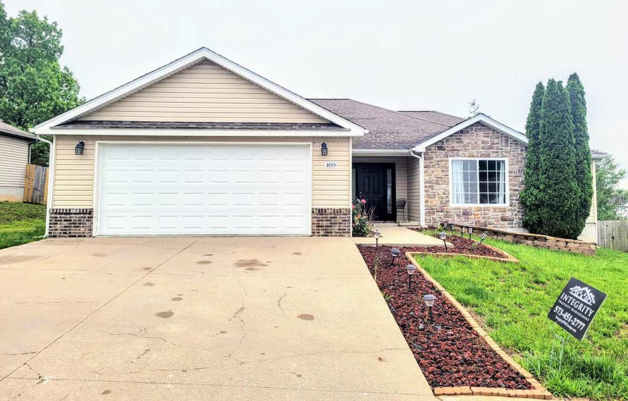 1 story home with a fence