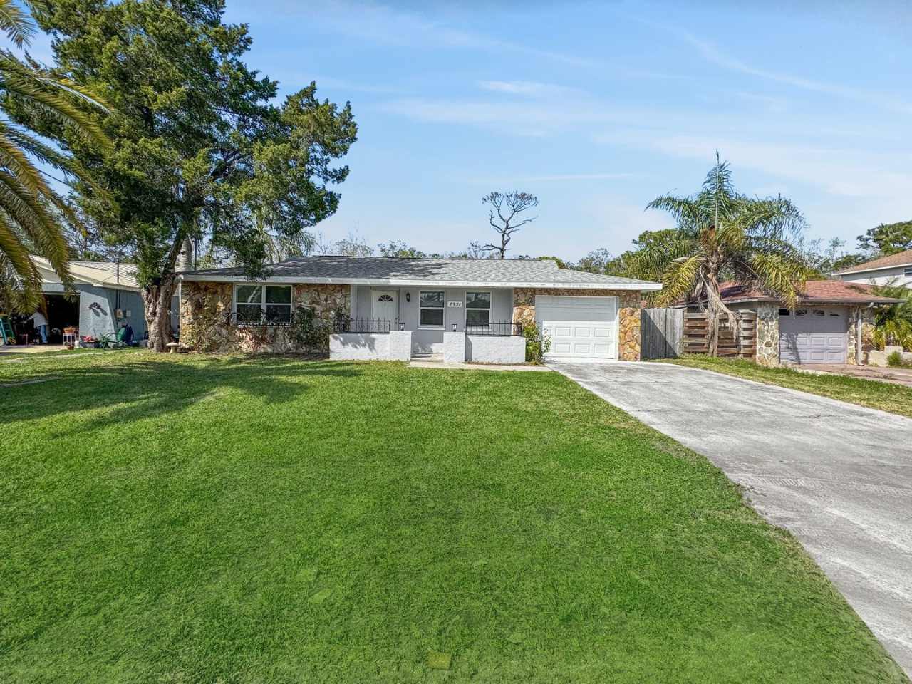 Fully Renovated 3-Bed, 2-Bath Home with Garage in Sea Pines, Hudson, FL – Open Floor Plan  Private Backyard!