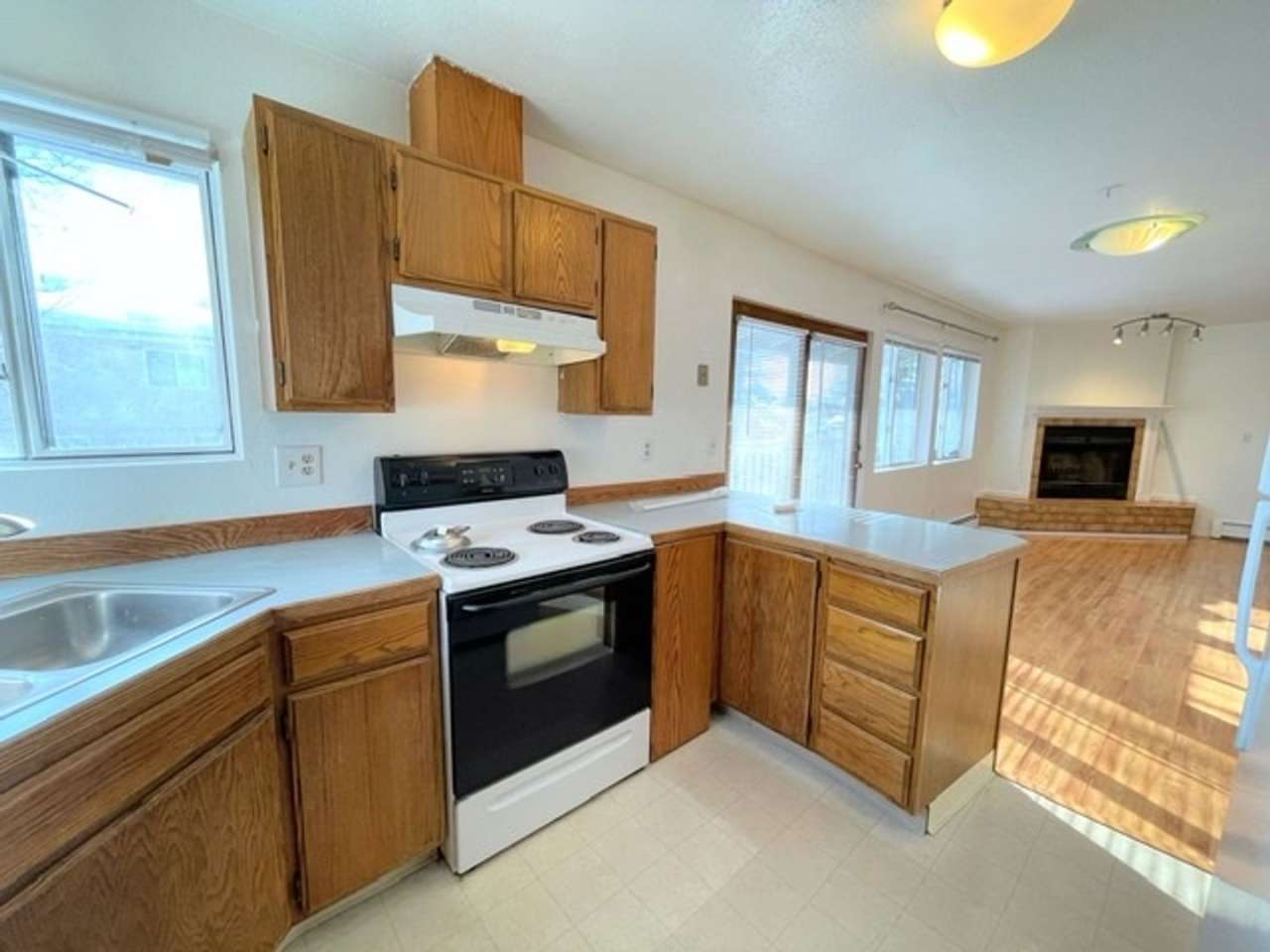 RARE FIND! Spacious and bright three bedroom apartment in South Anchorage with in unit laundry, fireplace, and balcony!
