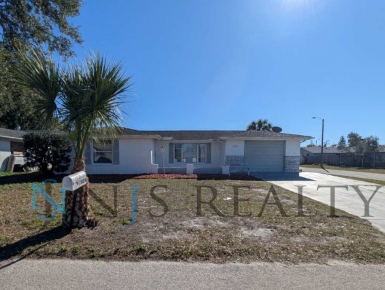 3/2/1 1508 Sq. Ft. LARGE Corner Lot home: Updated Kitchen  Baths, NEW paint, NEW floors, Fenced Yard with indoor laundry!