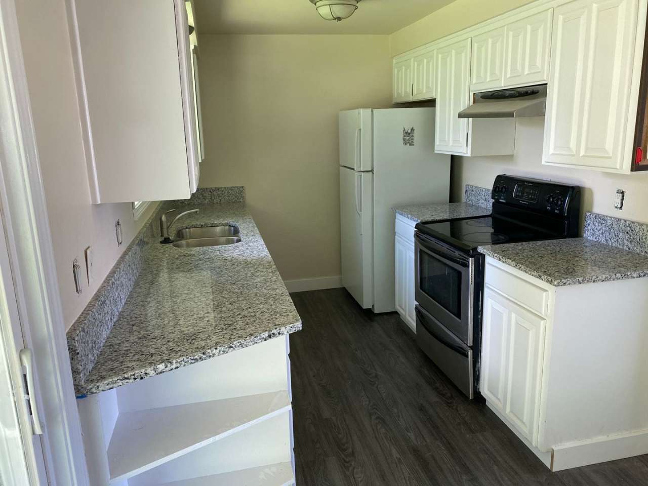 4 Bedroom, 2 Bathroom House with Large Fenced Backyard, New Vinyl Plank Flooring, Granite Countertops and Updated Bathroom with New Surround