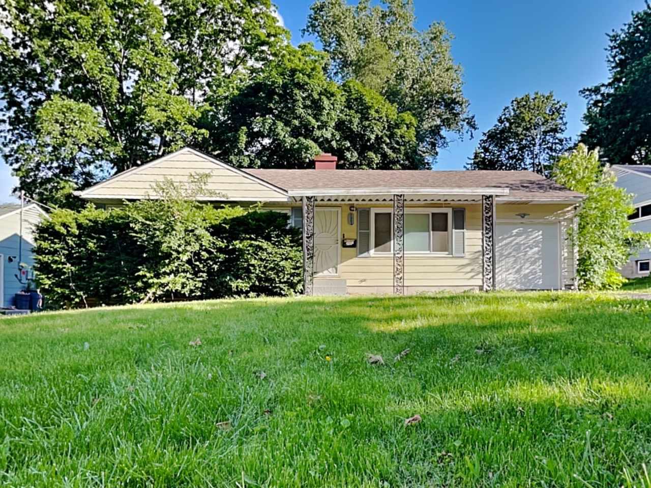 Charming 3-Bedroom Home with Sunroom, Fireplace  Garage in Kansas City, MO!