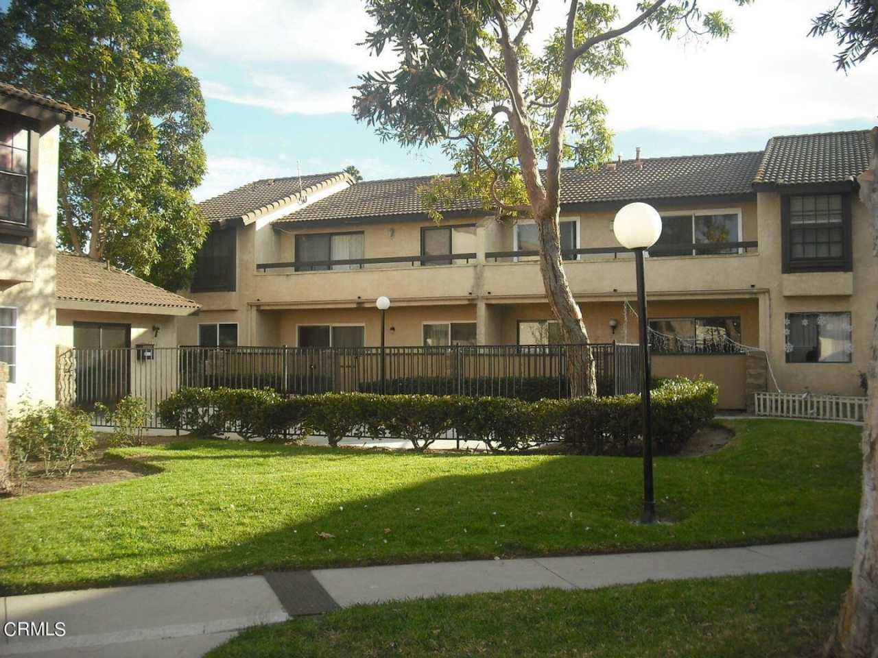 Charming Gated 2 bedroom and 1.5 Bath Condo with a Two-Car Garage