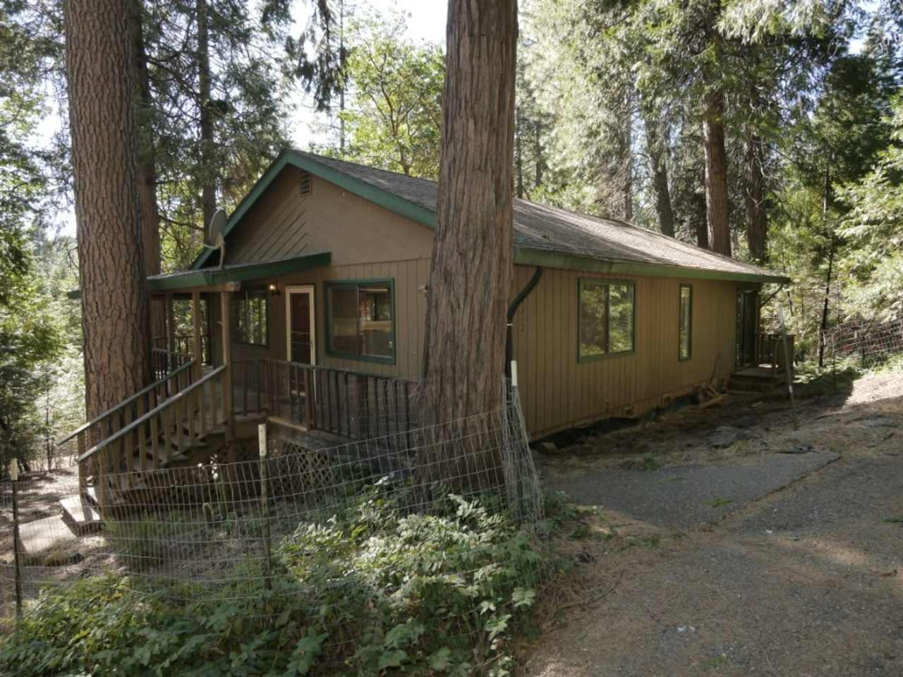 Two story home with large covered back deck at 27252 Cedar Bow Ct. in Pioneer.