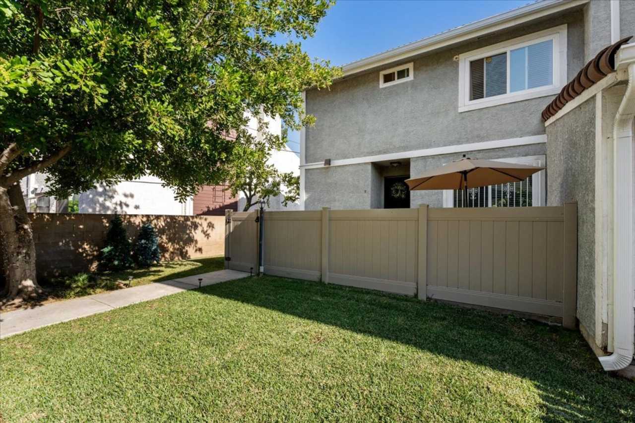 Updated Three Level Arcadia Townhome with Private Yard and Attached Garage