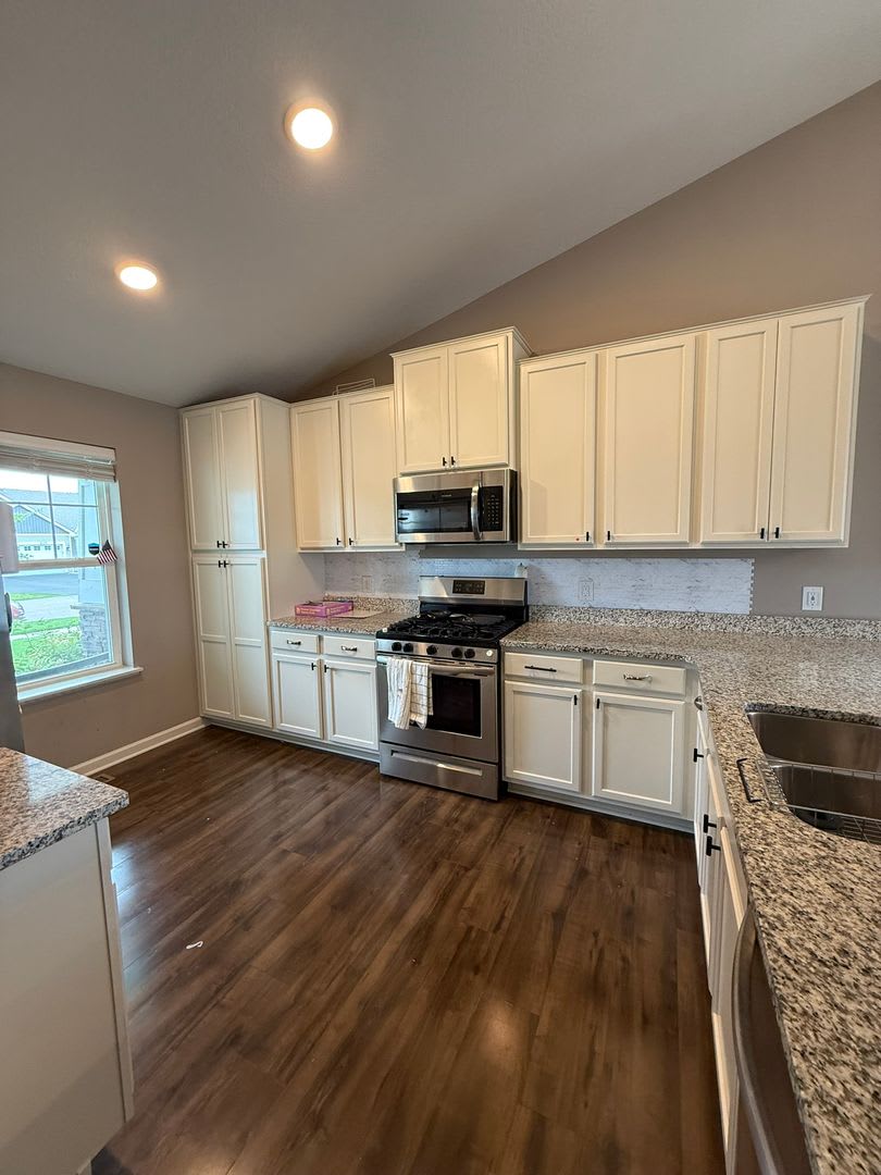 Spacious 4 BD | 2 BA Home with Finished Lower Walkout | 3‑Car Garage | Woodbury