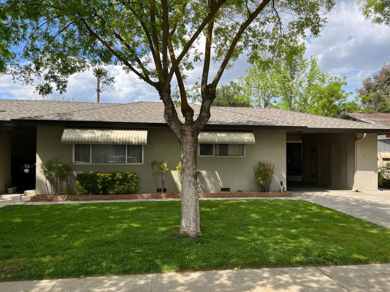 Two-bedroom single story unit with a carport!