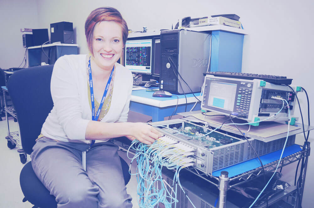 An APCON technician working on a switch