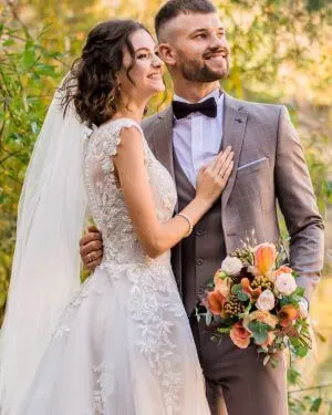 Smiling Couple in Wedding Attire