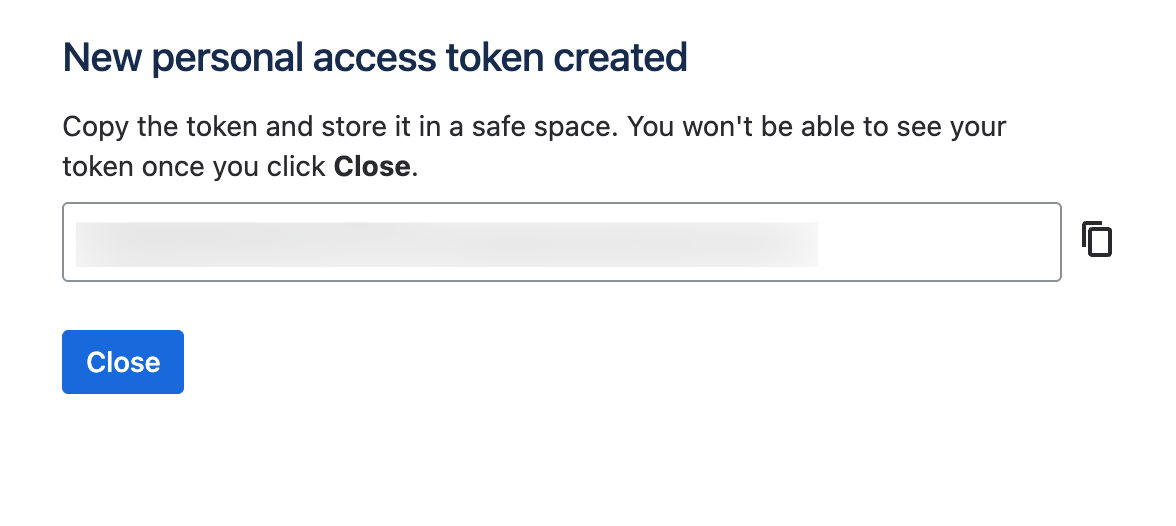 The generated personal access token shown once, with a copy button