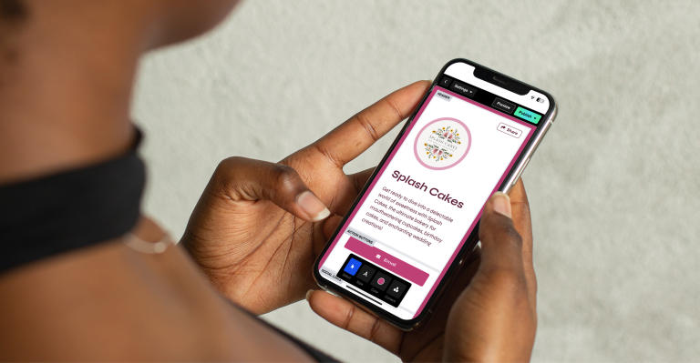 Woman holding a phone with a Savvy site on the screen