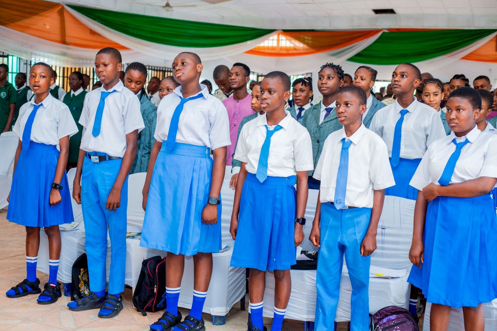 Pupils lined up in their school uniforms