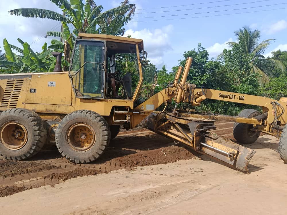 A grader at work on a community road