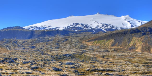 Snaefellsjökull - https://www.flickr.com/photos/mrgniqq/4637715917/in/photolist-84Pvng-57R4oR-covc49-i44zNe-57VfyG-SsU3N8-pxFK4e-oBoFds-5J3oGj-6PtBGu-8irNv6-2rj6R8-57R2g4-oBoLmd-TvdQdP-SsSGAM-TsMG2b-Sqbrzh-8VoijL-DxK5z9-57R2vv-i43WfF-D8WJXh-6PpsVH-SsSDqt-TD5kDC-5evoNk-TvdN8X-as2G1s-TvdMN8-TvdMTZ-i449ew-eYmva5-nRo8dz-6Gx34v-9SR4dU-5yJsYE-2L3gNq-8e6s4p-AzpcSB-i4456Q-dc21p1-i442ny-xgEpc1-5ezHEy-cJZ6dd-dc1YrM-5ezJhS-TvdN1n-5ezH4w