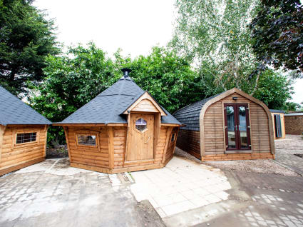 Two camping cabins sat beside a camping pod on our show site.