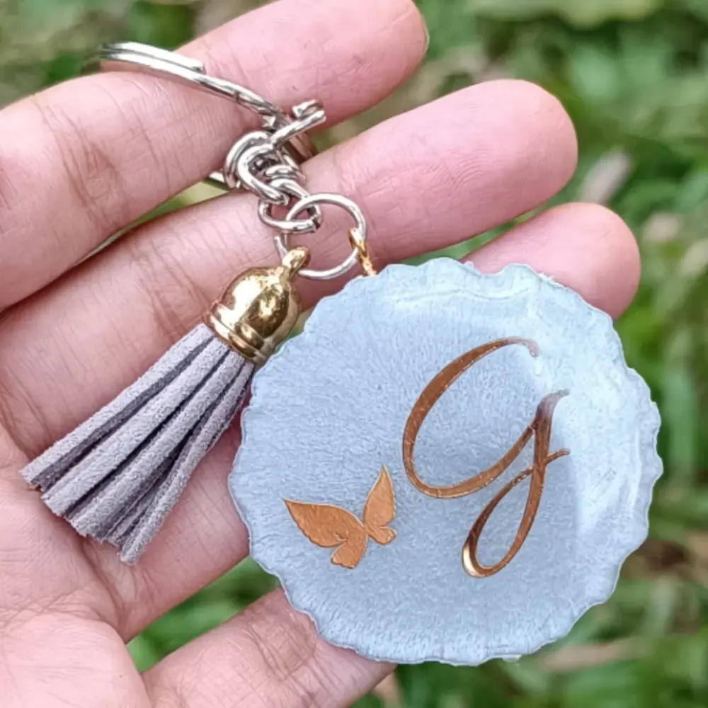 Resin customized keychain with initials with tassel for gifting loved ones