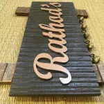 Customisable Wooden Nameplate with Brass Ghungroos, Copper Shade Aluminium Letters, Hand Painted, PU Polished, 12x7 Inches