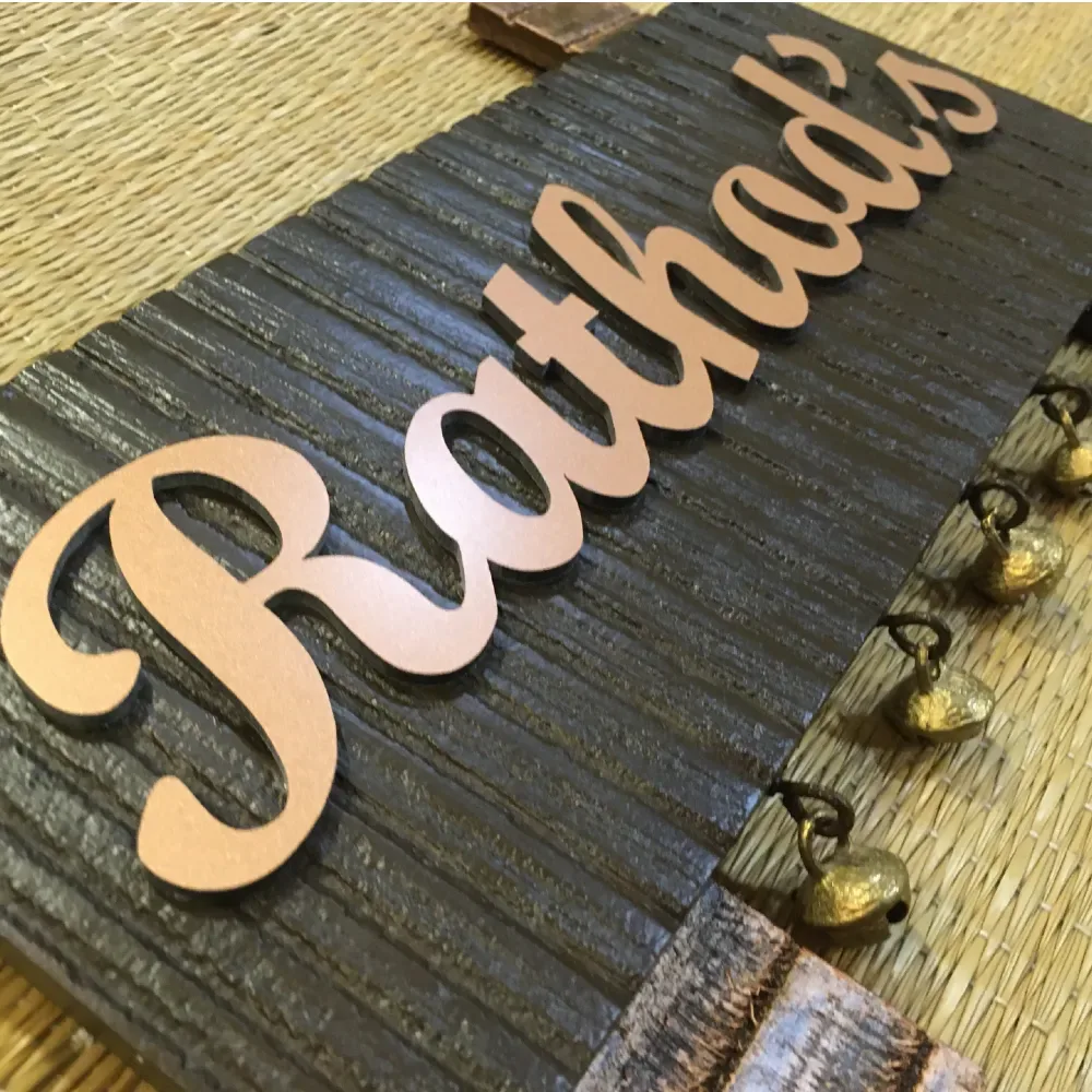 Customisable Wooden Nameplate with Brass Ghungroos, Copper Shade Aluminium Letters, Hand Painted, PU Polished, 12x7 Inches