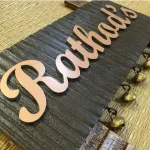 Customisable Wooden Nameplate with Brass Ghungroos, Copper Shade Aluminium Letters, Hand Painted, PU Polished, 12x7 Inches