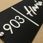 Custom House Name Plate with Number, Black Matte Acrylic Base, White 3D Letters, Stainless Steel Mirror Caps, 30 x 15 cm