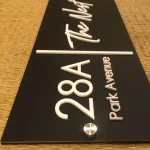 Customisable House Name and Number Sign, Matte Black Acrylic Base, White Acrylic Letters, Stainless Steel Mirror Caps, 30 x 15 cm