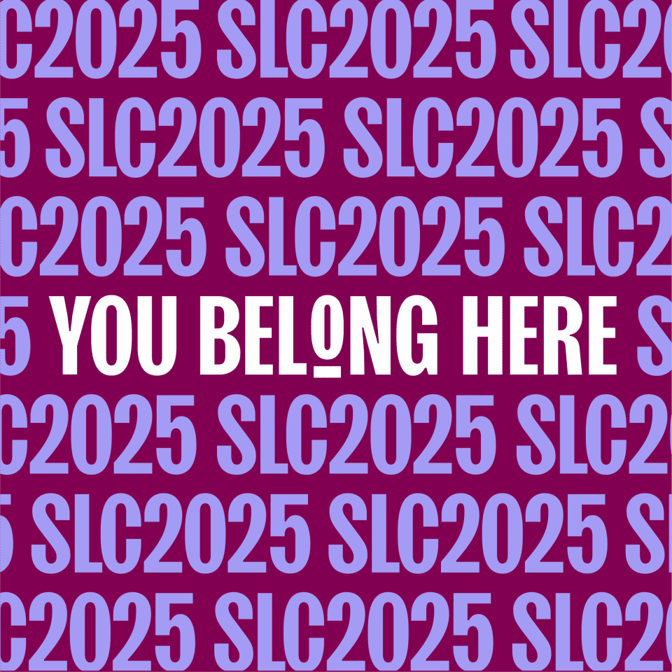 Bold white text reads "YOU BELONG HERE" centered on a maroon background, overlaid by repeated blue text "SLC2025" in a pattern.