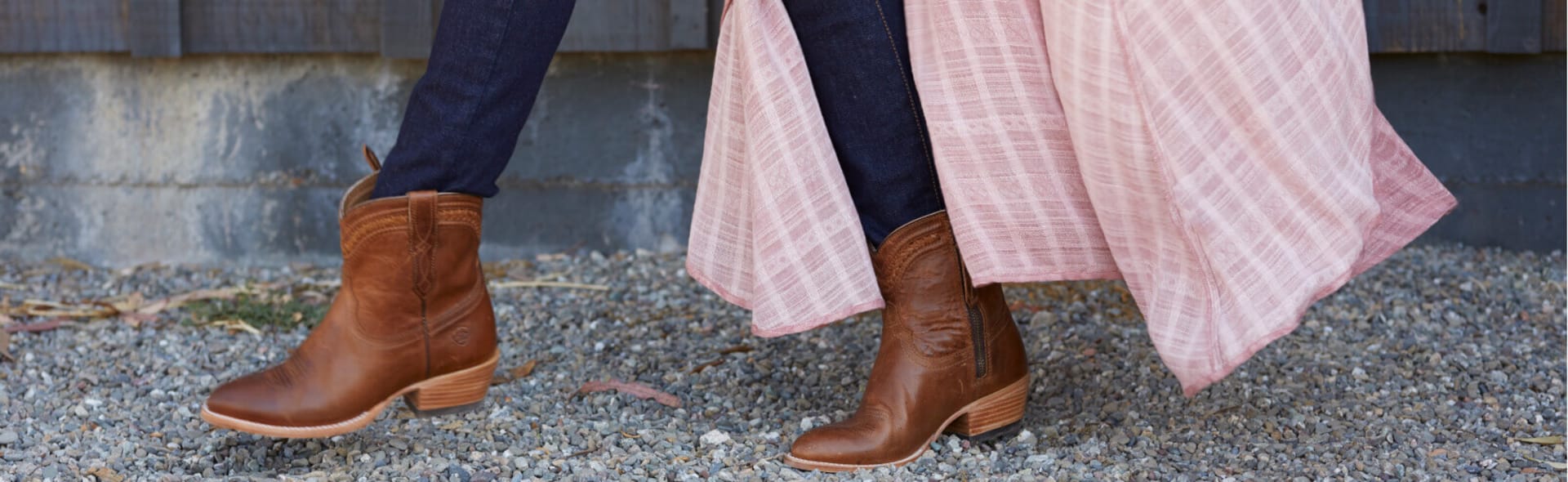 woman's boots with jeans tucked in