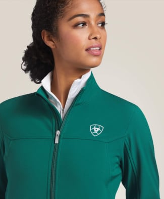 woman in green softeshell jacket