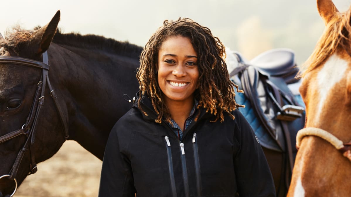 Brianna Noble with two horses