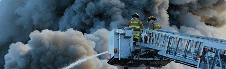 Firefighters responding to an emergency scene with resilient field connectivity.