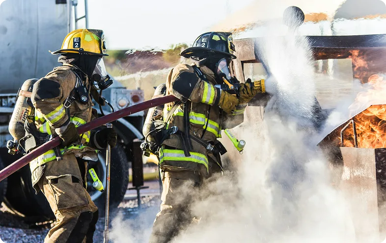 Firefighters operating at an incident with connected field communications and drones.