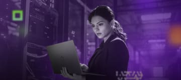 woman using laptop in a data center