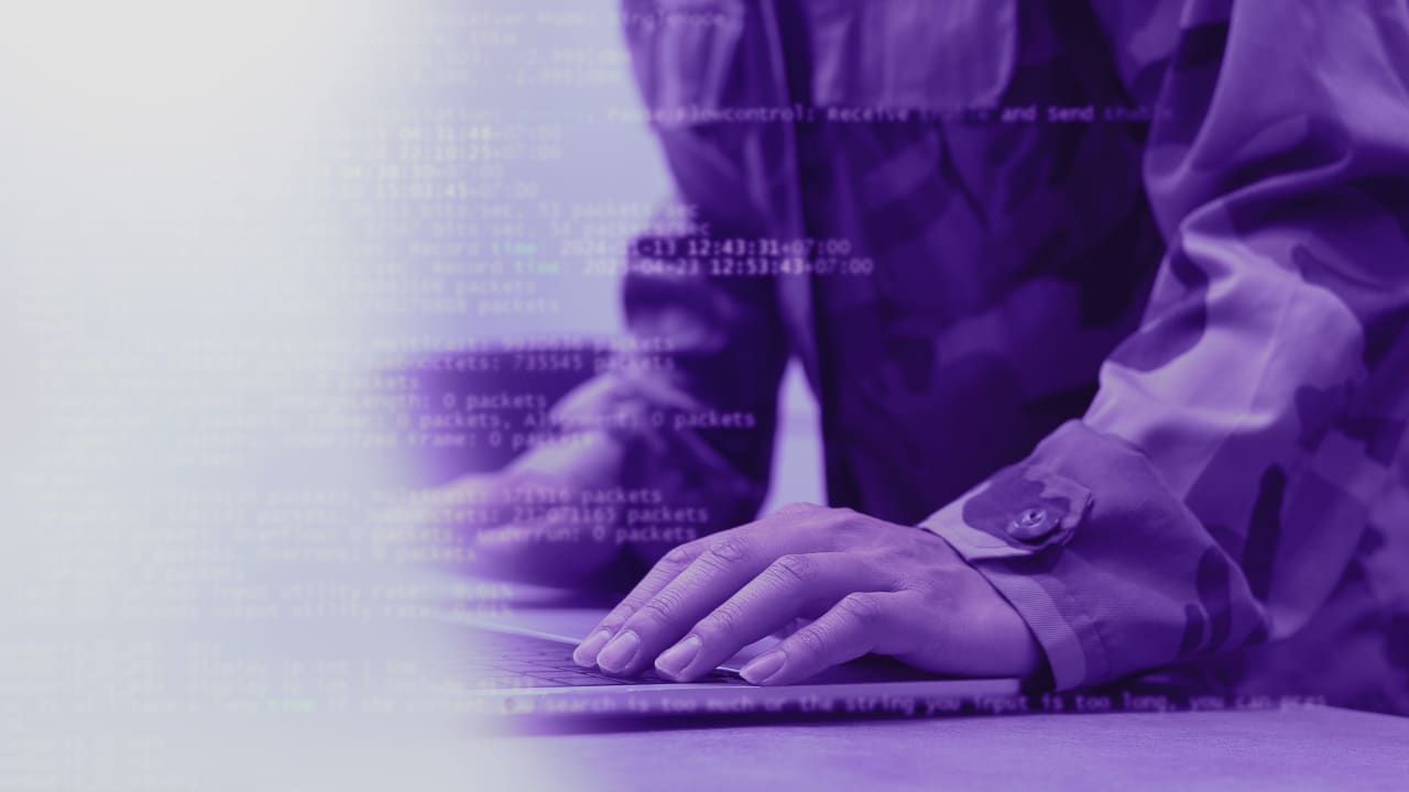 Soldier programmer hand typing command on keyboard laptop to check about software or configuration for military operation system