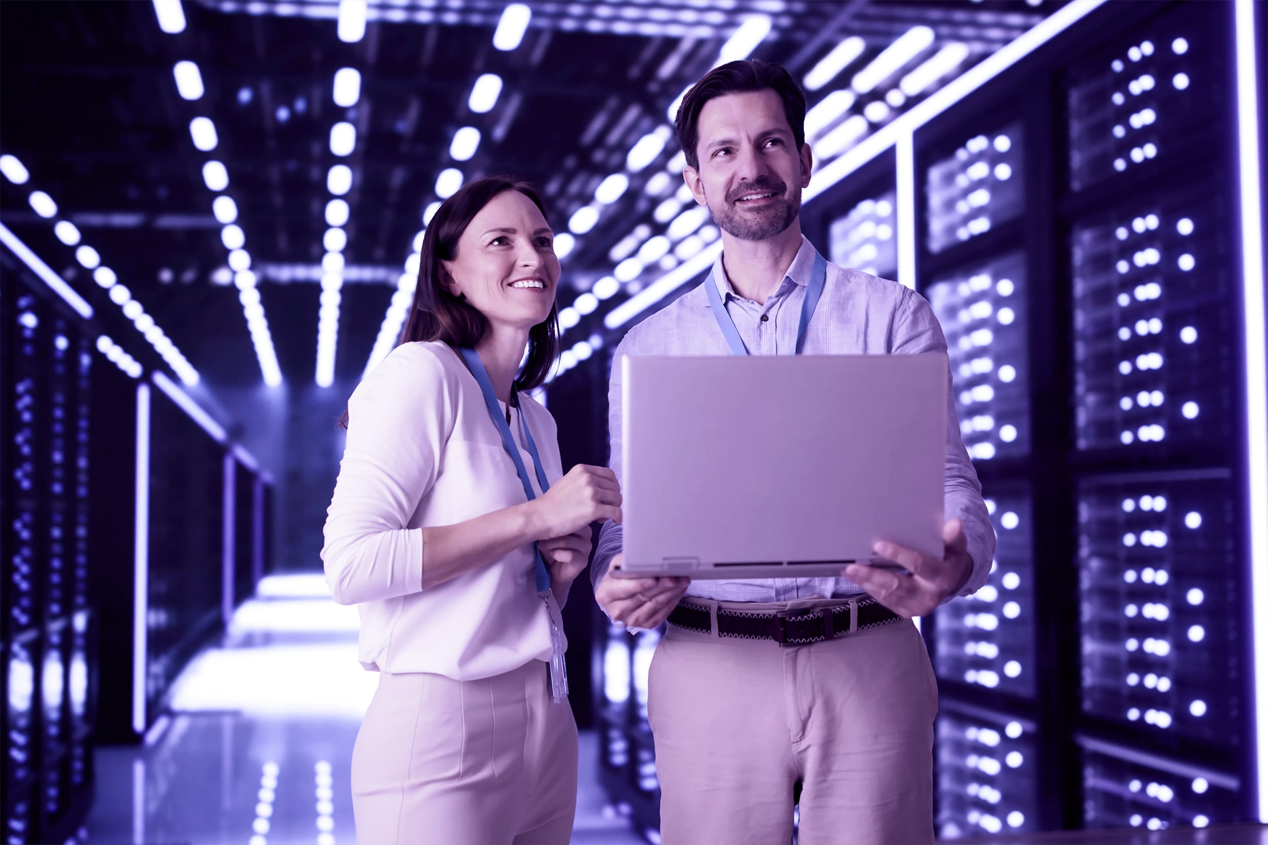 Cloud Computer Engineers Configuring AI Technology in a Server Room In Data Center
