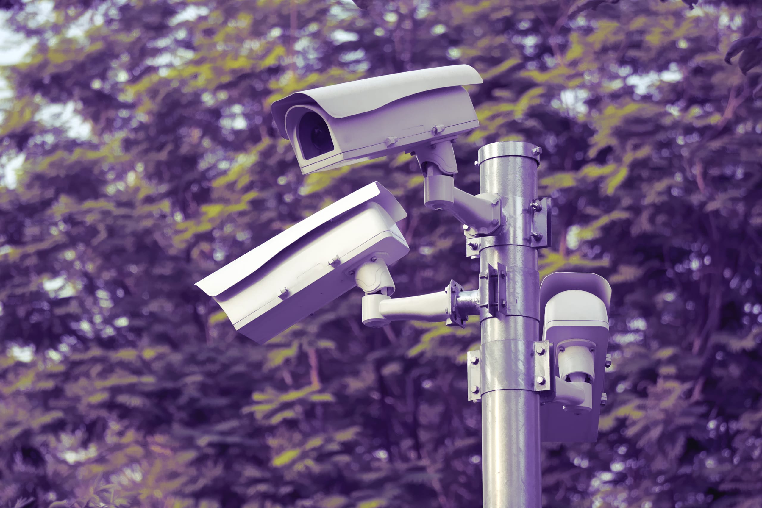 cc tv cameras on metal pole in public park