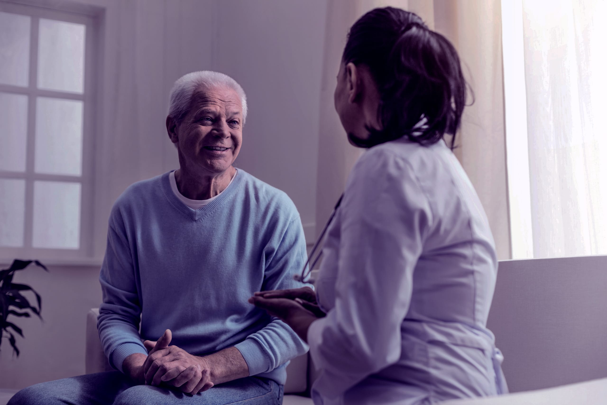 cheerful man having a conversation with a doctor