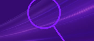 magnifying glass on purple background