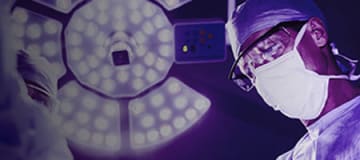 surgeon operating in a operating room