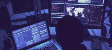 hacker coding malware using computers